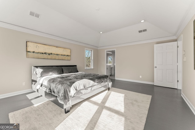 bedroom featuring ensuite bathroom, a raised ceiling, lofted ceiling, and crown molding