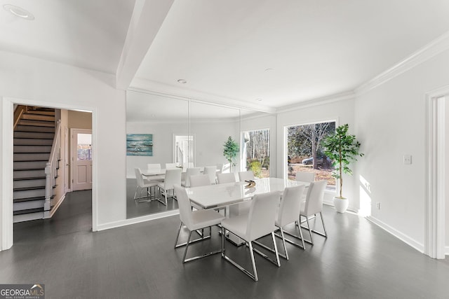 dining space with crown molding