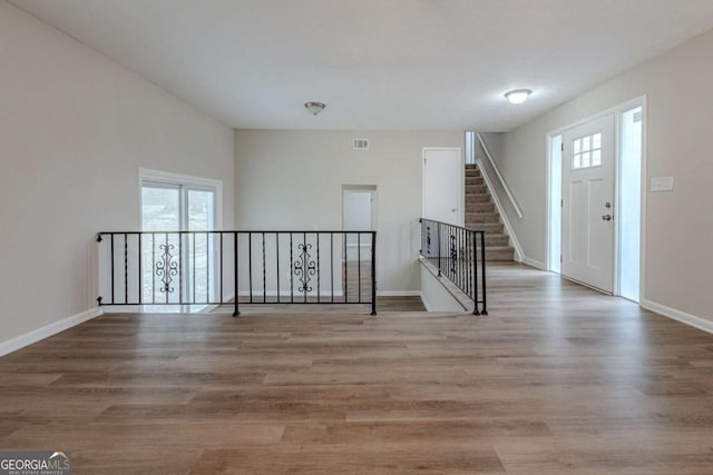 entryway featuring light hardwood / wood-style floors and a healthy amount of sunlight