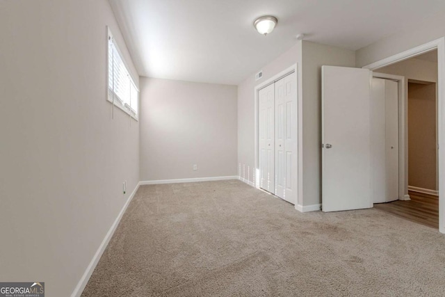 unfurnished bedroom with carpet