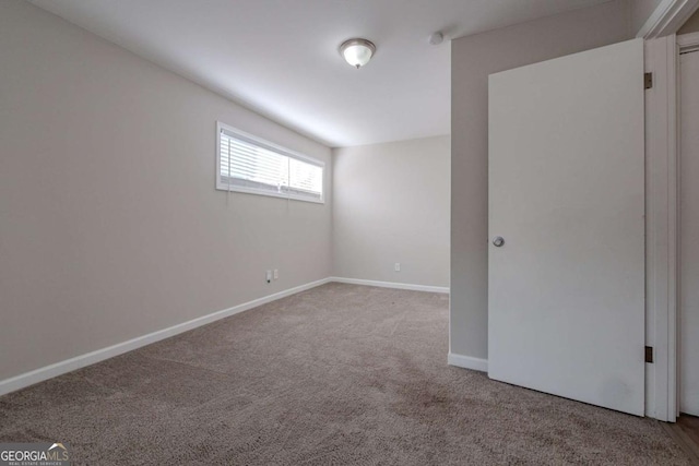 empty room featuring carpet flooring