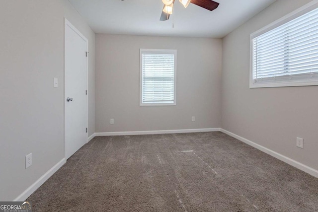 unfurnished room featuring carpet and ceiling fan