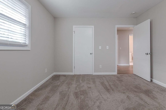 unfurnished bedroom with carpet