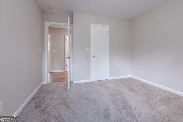 unfurnished bedroom with carpet floors