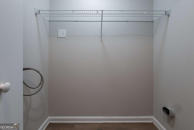 laundry area featuring dark hardwood / wood-style flooring