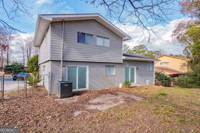 rear view of house with central air condition unit