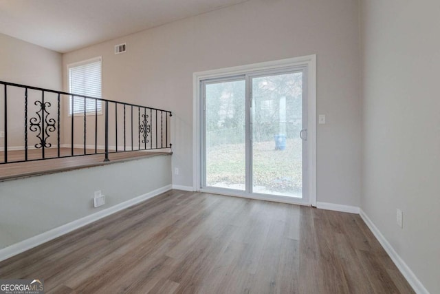 empty room featuring hardwood / wood-style flooring