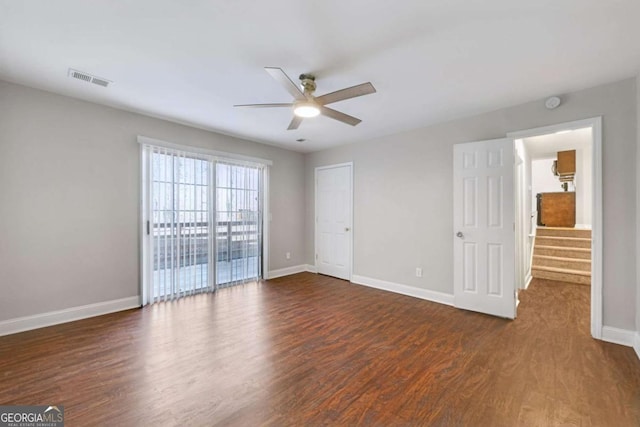 interior space featuring ceiling fan and dark wood-type flooring