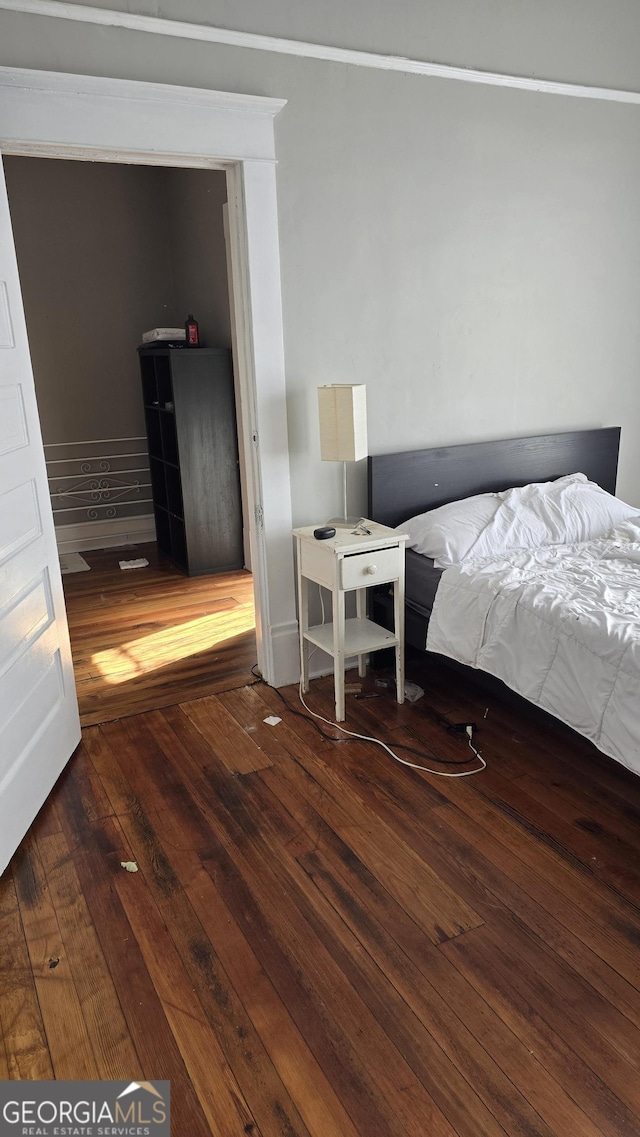 bedroom featuring dark hardwood / wood-style floors