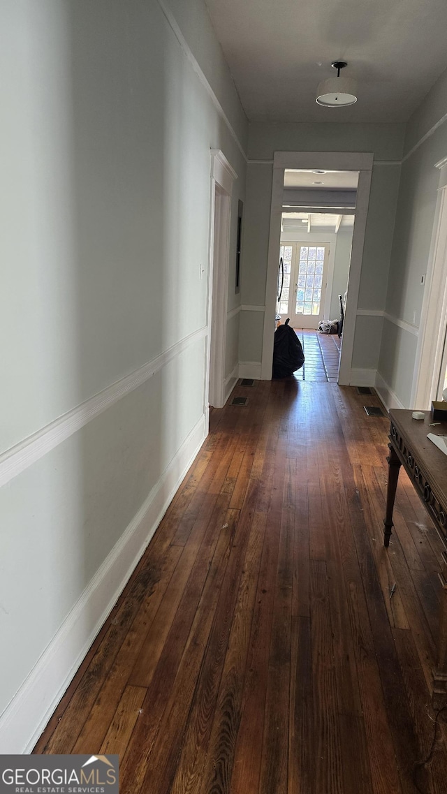 hallway featuring dark wood-type flooring