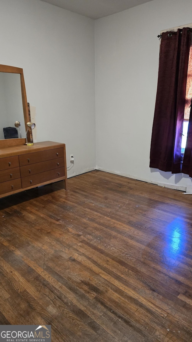 bedroom featuring dark wood-type flooring