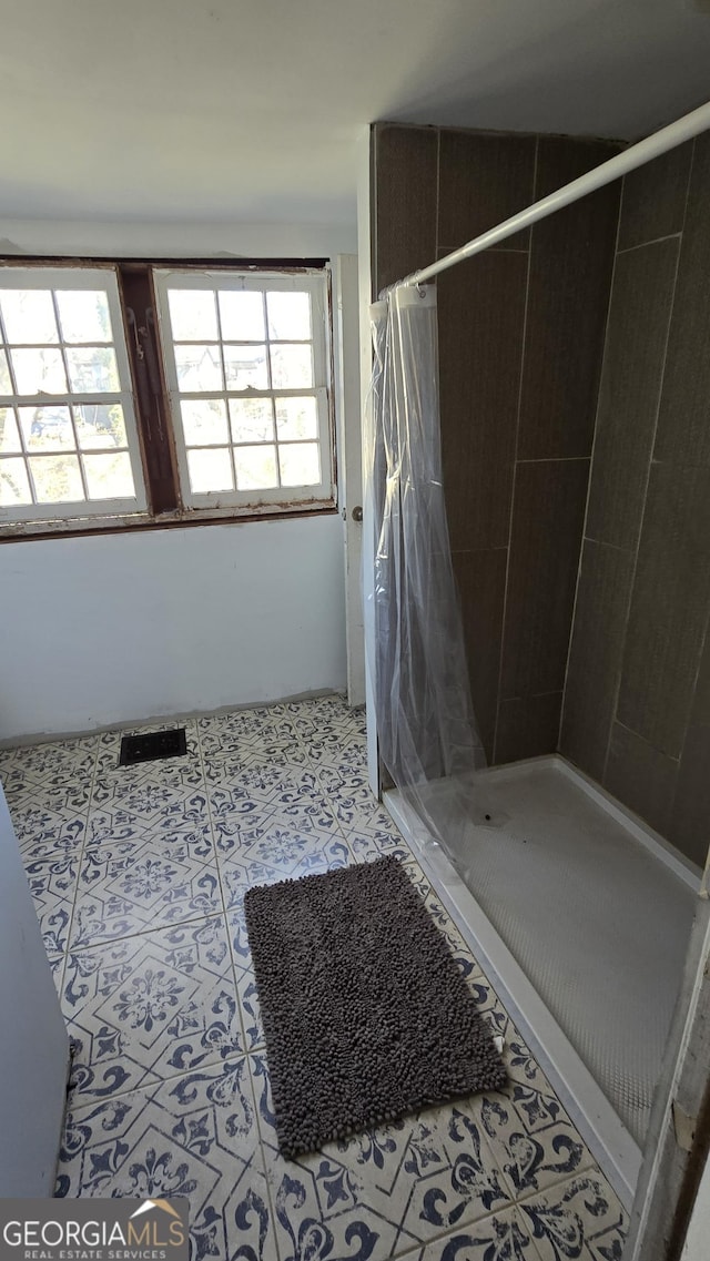 bathroom featuring a shower with curtain