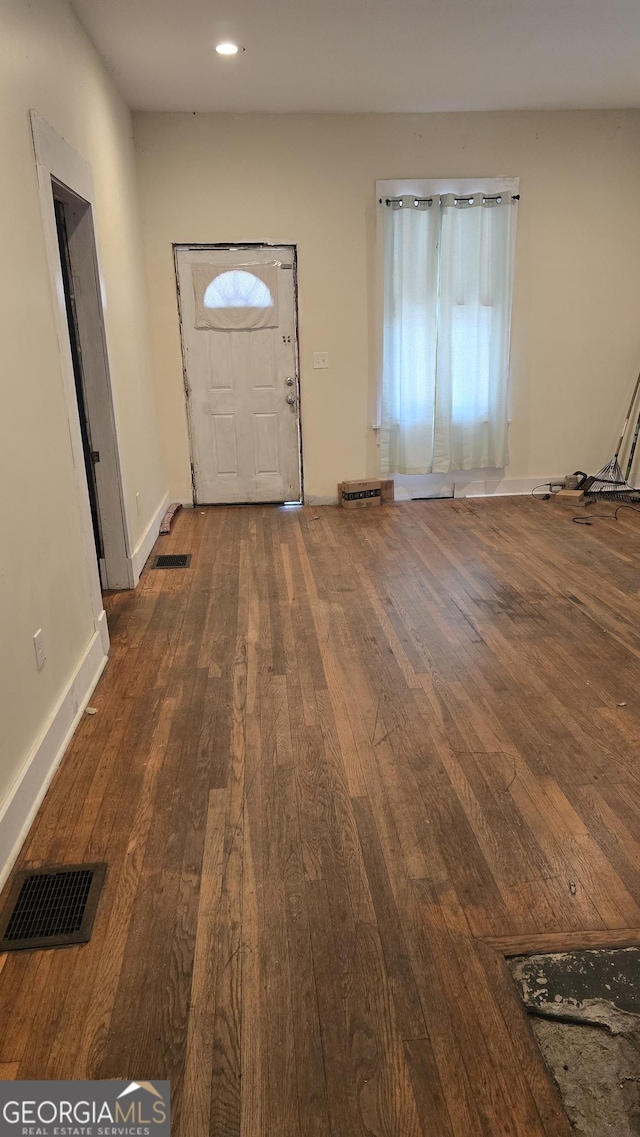 entrance foyer featuring dark hardwood / wood-style floors