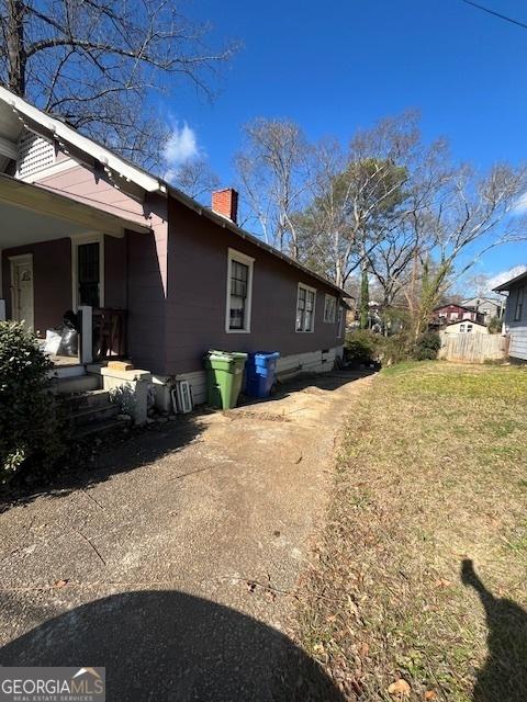 view of home's exterior with a lawn