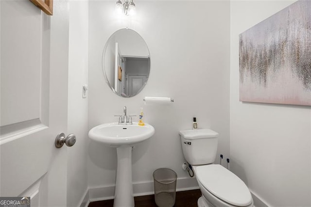 bathroom featuring toilet and sink