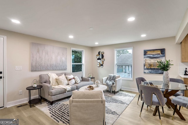 living room with light hardwood / wood-style floors