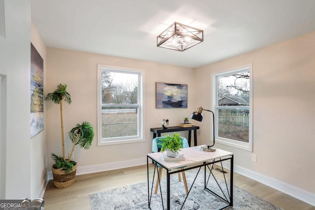 office area with light hardwood / wood-style flooring