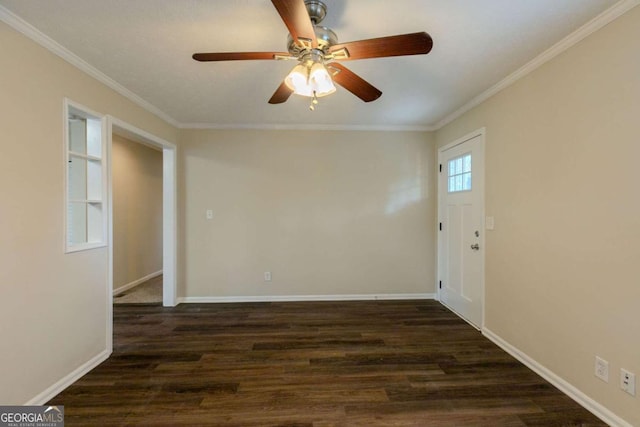 spare room with dark hardwood / wood-style floors, ceiling fan, and crown molding