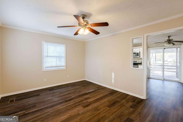 empty room featuring dark hardwood / wood-style floors, ceiling fan, ornamental molding, and a textured ceiling