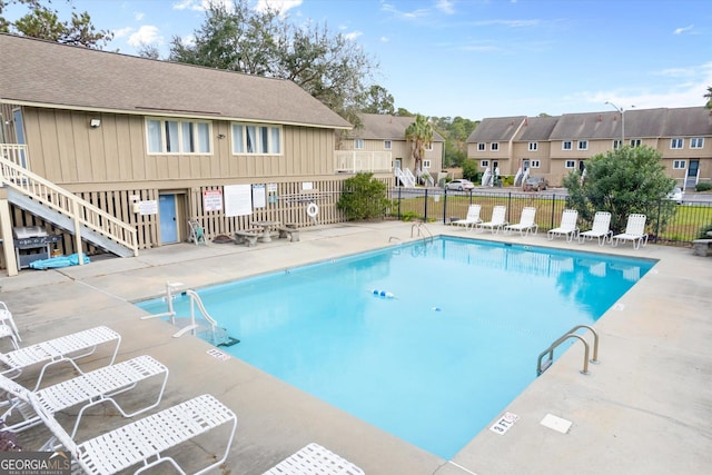 view of swimming pool featuring a patio area