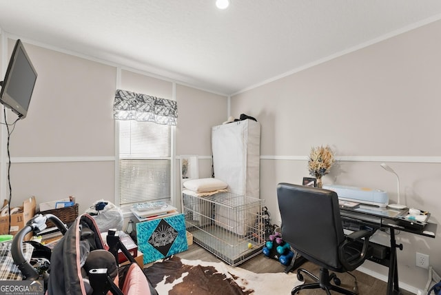 office area featuring hardwood / wood-style floors and ornamental molding