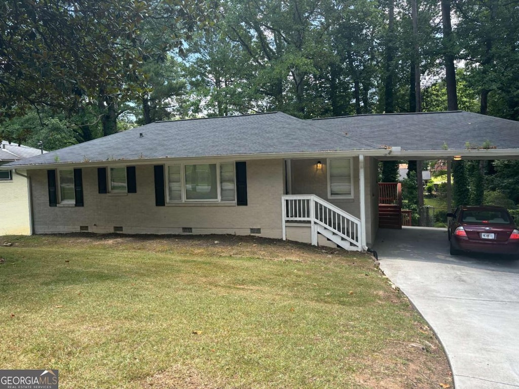 single story home with a carport and a front yard