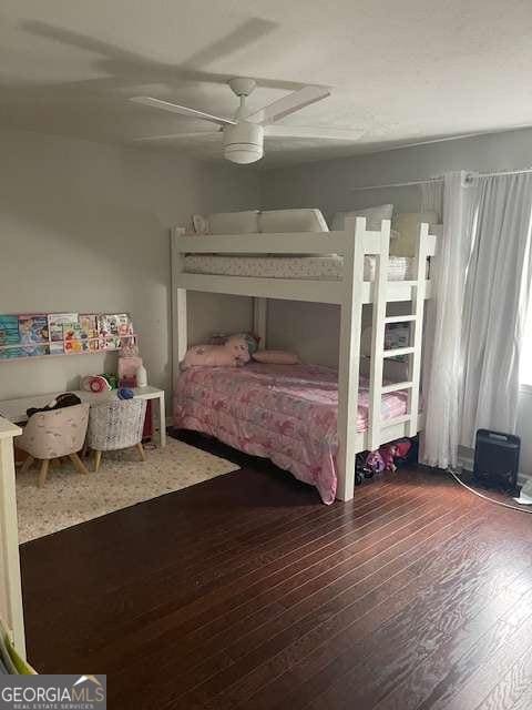 bedroom featuring ceiling fan and wood-type flooring