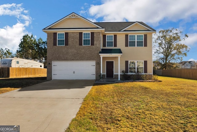 view of front facade featuring a front lawn and a garage