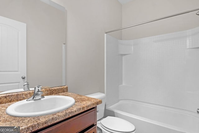 full bathroom with bathtub / shower combination, vanity, and toilet