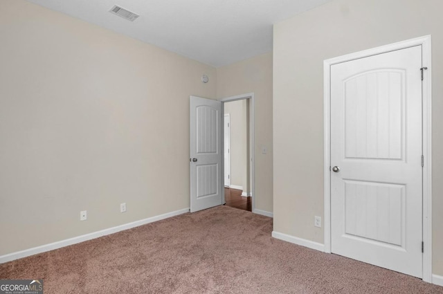 unfurnished bedroom featuring carpet floors