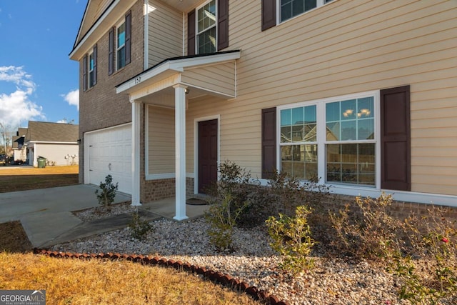 property entrance with a garage