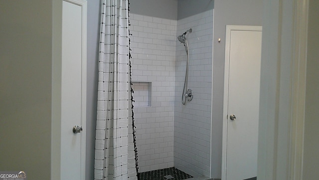 bathroom with curtained shower