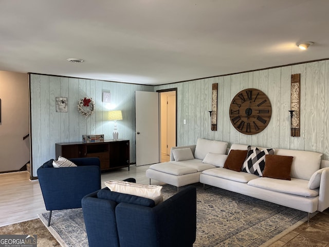 living room with wood walls