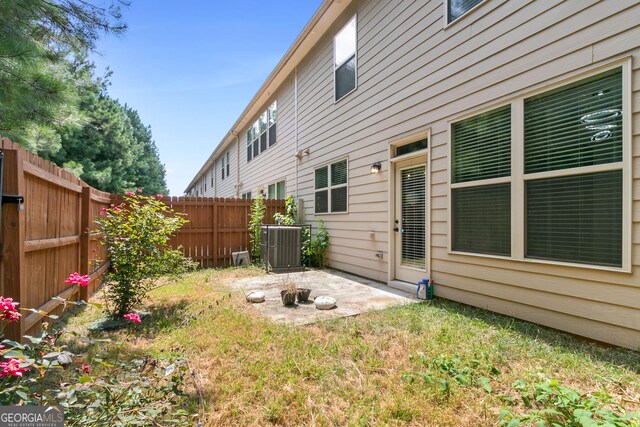 view of yard with a patio and central AC
