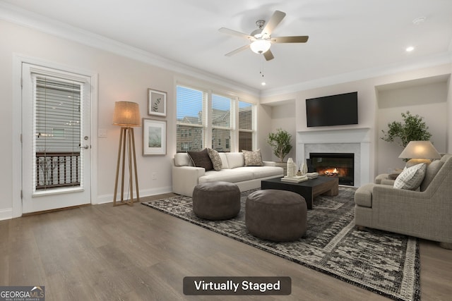 unfurnished living room with dark hardwood / wood-style floors, ceiling fan, sink, and crown molding