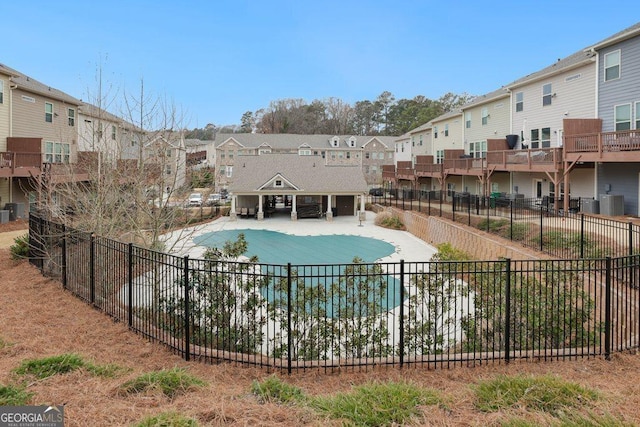 view of property's community with a lawn, an outdoor fire pit, and a patio