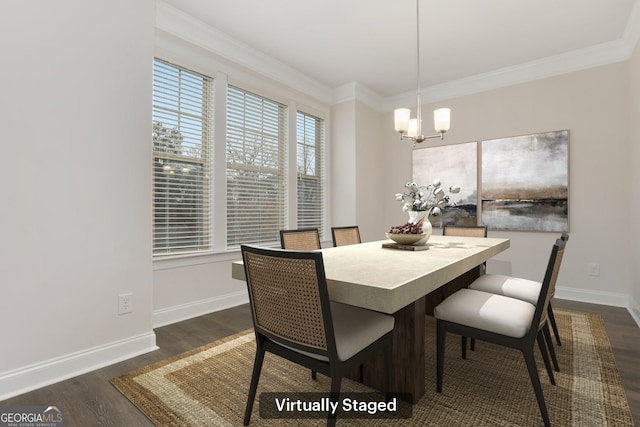 unfurnished dining area featuring dark hardwood / wood-style floors, an inviting chandelier, and ornamental molding