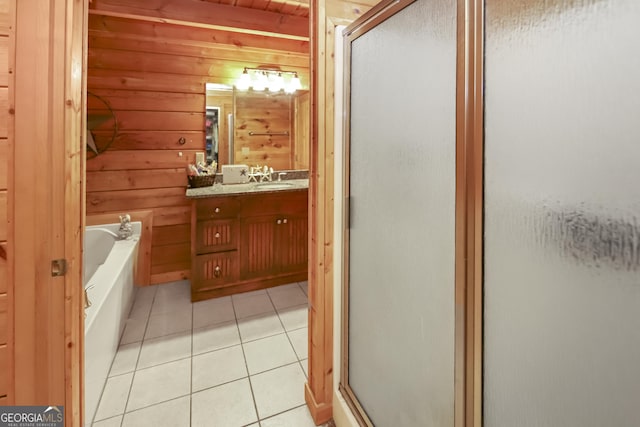 bathroom with wood walls, tile patterned flooring, and independent shower and bath