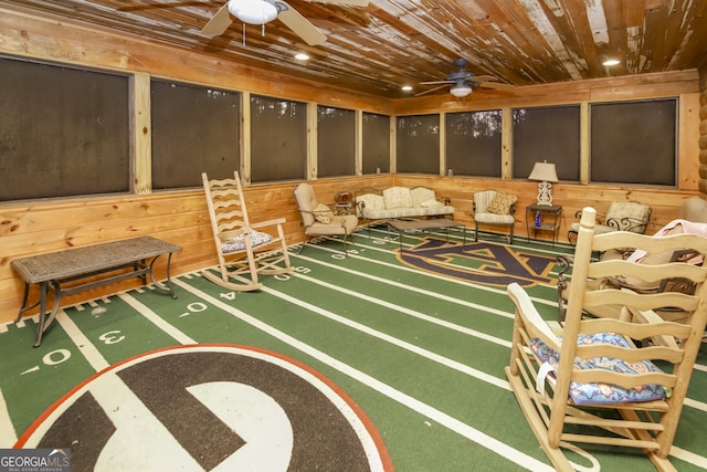 game room featuring carpet, wooden walls, ceiling fan, and wooden ceiling