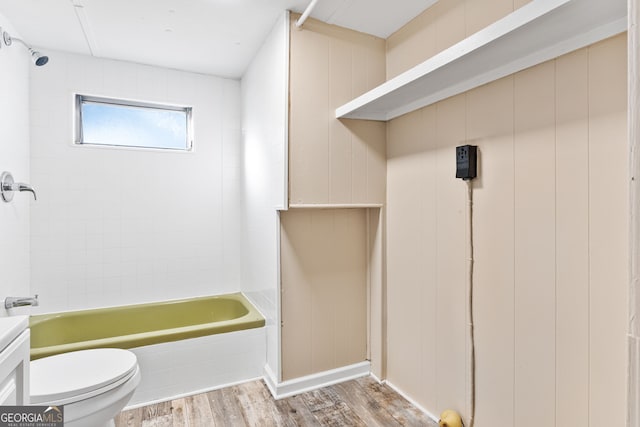 full bathroom featuring vanity, shower / bath combination, hardwood / wood-style flooring, and toilet