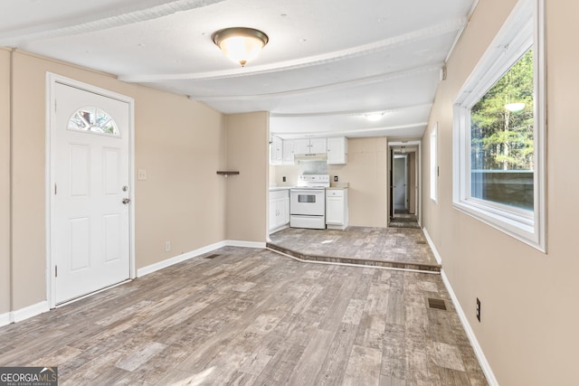 unfurnished living room with light hardwood / wood-style floors