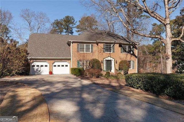 colonial-style house featuring a garage