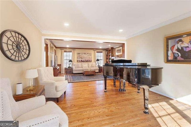 sitting room featuring light hardwood / wood-style floors and ornamental molding