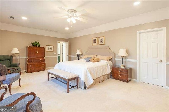 bedroom featuring ceiling fan and light colored carpet