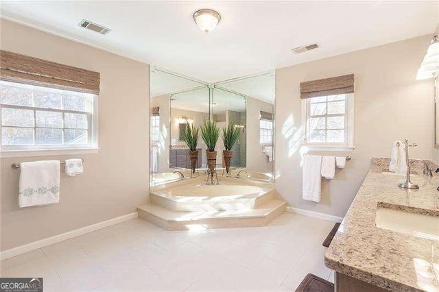 bathroom with tile patterned flooring and vanity