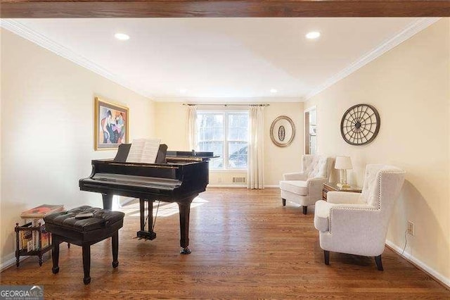 miscellaneous room featuring hardwood / wood-style floors and crown molding