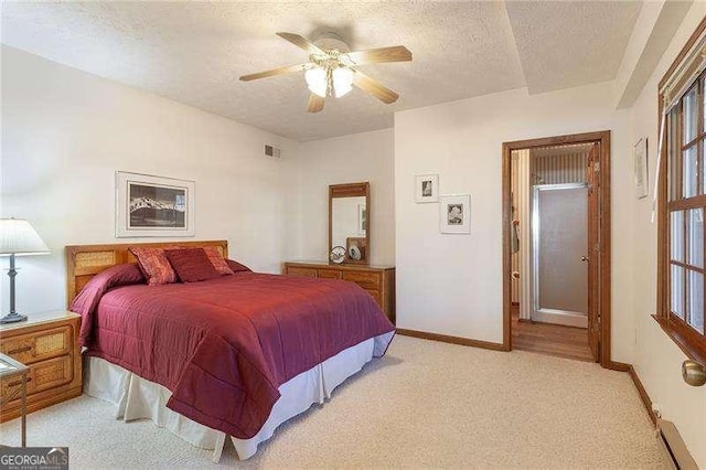 bedroom with ceiling fan, light colored carpet, a textured ceiling, and a baseboard radiator