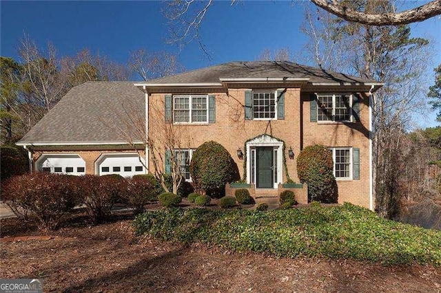 colonial home with a garage