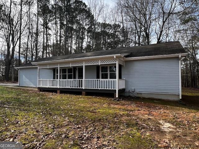 ranch-style home featuring crawl space and a porch