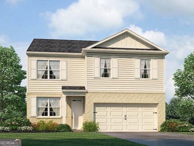 view of front of house with a front lawn and a garage